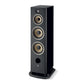 The Focal ARIA EVO X N°4 is a black speaker with three large circular drivers, a tweeter on top, and a bass port near the bottom on a sturdy base.