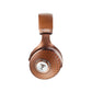 Focal Stellia headphones in copper, shown from the side with a textured circular pattern and Focal logo on the ear cup featuring Beryllium drivers.