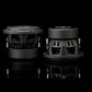 Deux subwoofers Gladen Sigma SSWX08 noirs de 8 pouces sont disposés côte à côte sur une surface noire brillante — lidéal pour toute installation audio automobile haut de gamme.