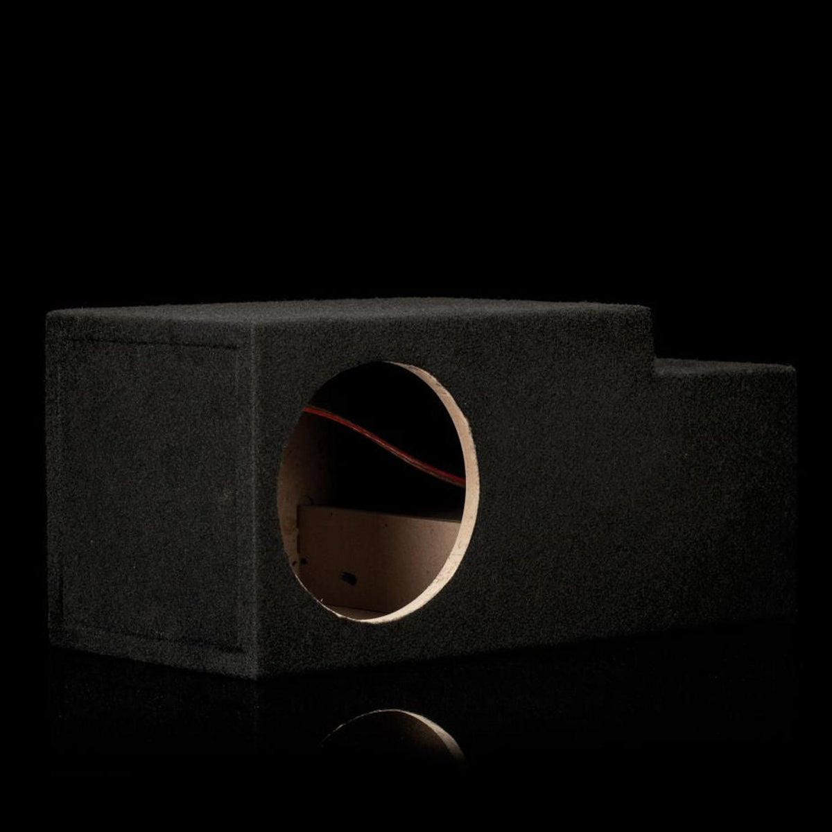 Gladen Subbox-Buz.1 black subwoofer enclosure featuring a circular cutout and tiered top, displayed on a black background.