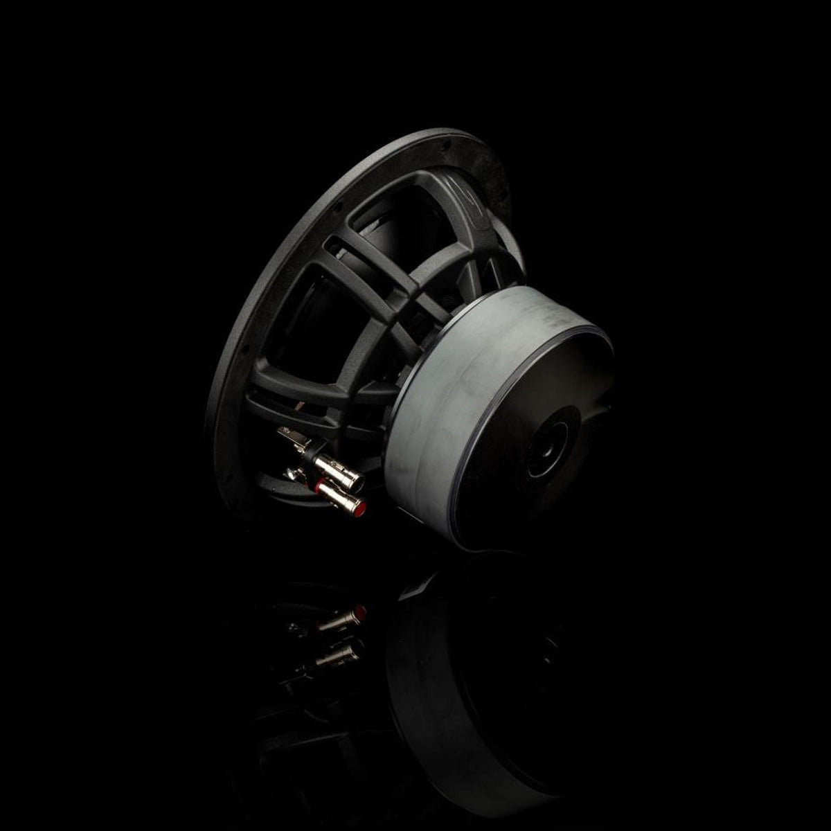 The Gladen Zeta 08 is a black 8 subwoofer with exposed wiring and terminals, delivering powerful bass, shown on its side against a black background.