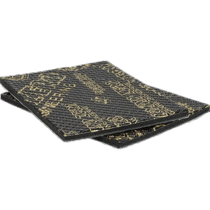 Two black rectangular Ground Zero GZDM 250AL-BassBoost mats 2x 25x18cm with gold branding, slightly overlapping on a white background.