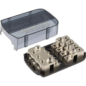 De Ground Zero GZFH 3.50/4.20 ANL/MANL is een rechthoekig metalen verdeelblok voor autogeluid met meerdere aansluitingen en een transparant deksel.
