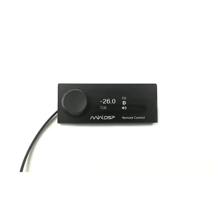The miniDSP CDSP OLED Remote in black features a display showing -26.0, a left-side knob, and a connected cable—ideal for your CDSP Plattform setup.
